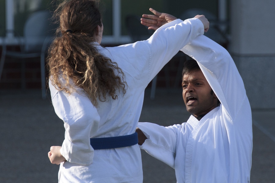 Members of the Shotokan Karate Club practice on the lawn in front of the Zesiger Center. Here, postdoc Arul Sundaramoorthy (facing camera) practices a rising block—counterpunch with graduate student Avril Kinney.