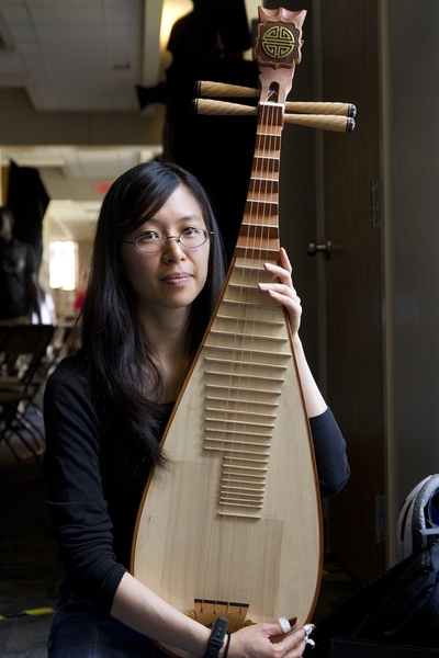 Annie Wang &#39;04, MEng &#39;04, PhD &#39;11, from the MIT Chinese Ensemble, holds her pipa, a traditional Chinese four-string lutes, as she prepares for a talent show at Next House.