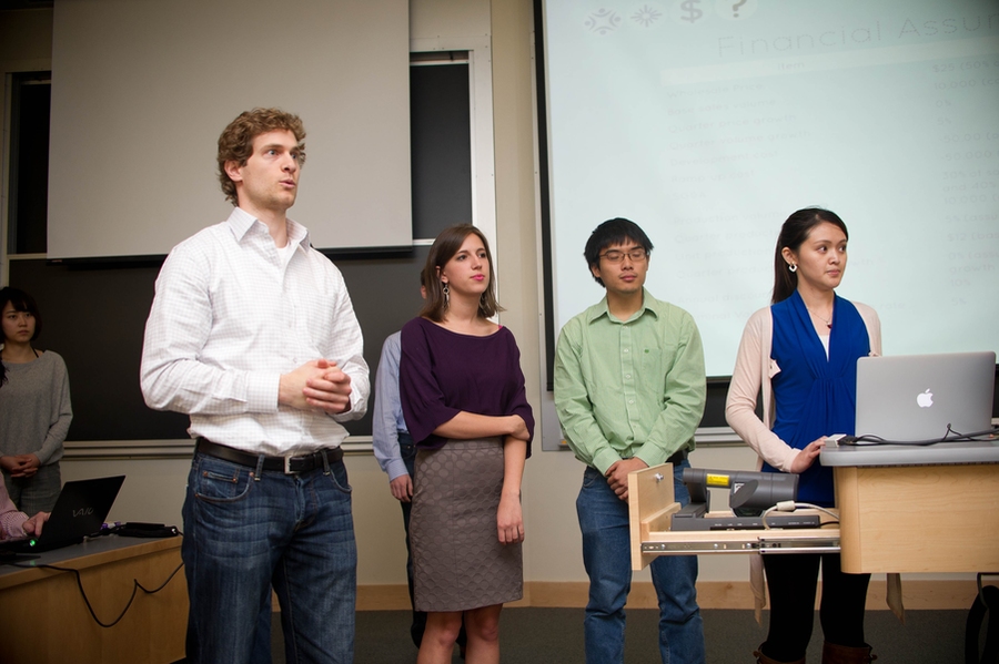 A team of students from MIT's School of Engineering and Sloan School of Management and from RISD defend their design of a laundry hamper/backpack hybrid to reviewers from the product development and venture capital communities.
From left to right: Esther Lee (MIT Leaders for Global Operations, or 'LGO'), Kurtis Mckenney (LGO), Beth Soucy (RISD), Peter Tia (mechanical engineering), P...