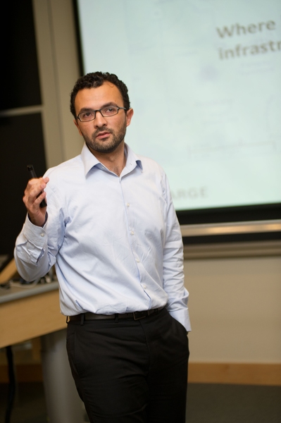 Erick Corona, an LGO student, explains to a jury of reviewers the value of his design team's solution for charging electric vehicles at the workplace.