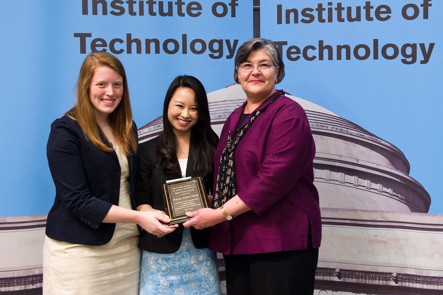 Judy Cole presents the D. Reid Weedon JR '41 Alumni/ae Relations Award to Kappa Alpha Theta. Juniors Clare Frigo and Nancy Chen accepted the award on behalf of Kappa Alpha Theta.