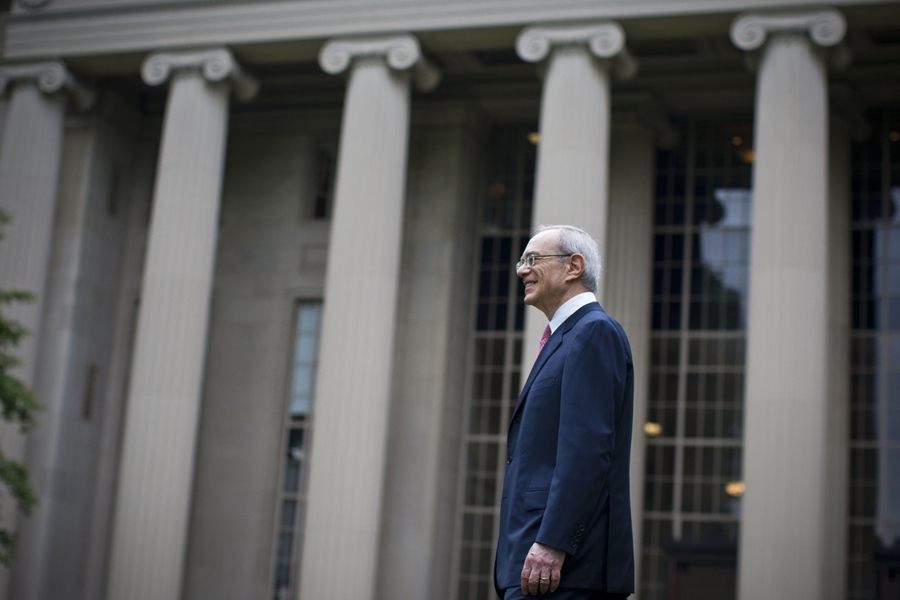 Reif walks through Killian Court during a reception following the community event.