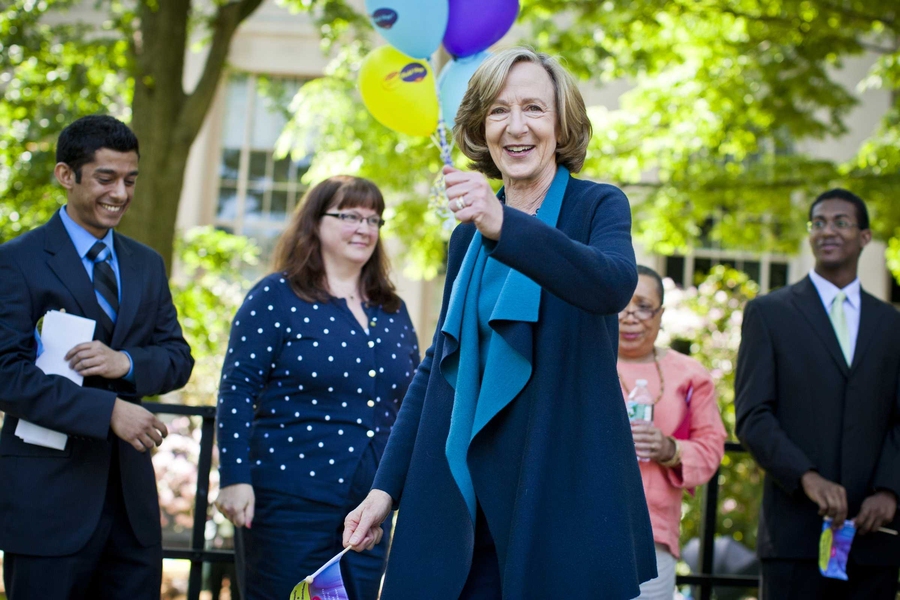 MIT President Susan Hockfield watches as a flash mob breaks out in Killian Court.