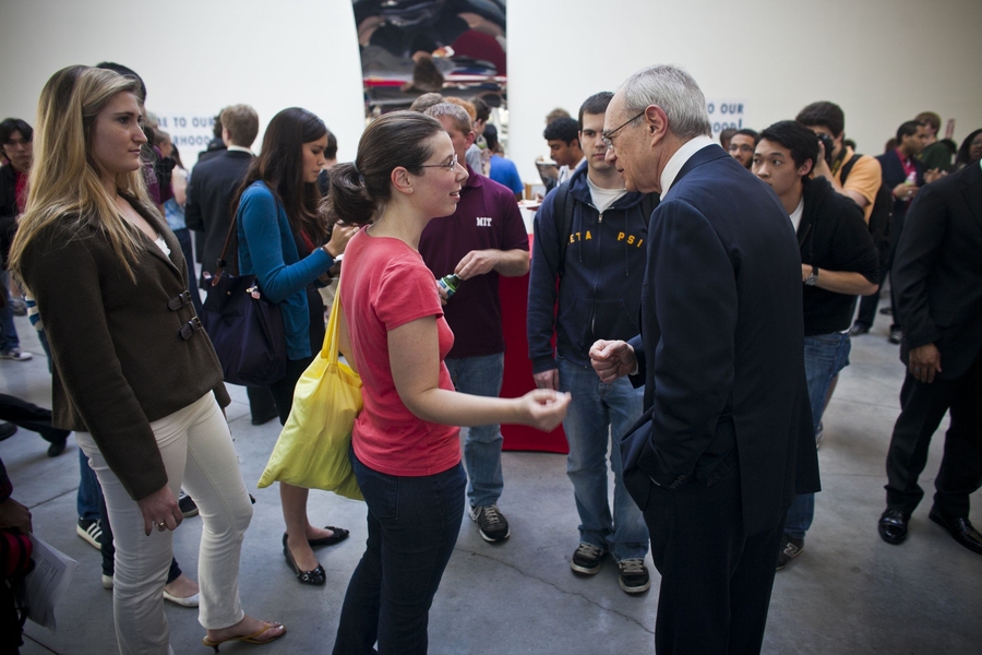Reif talks to a student at a welcome event in the evening.