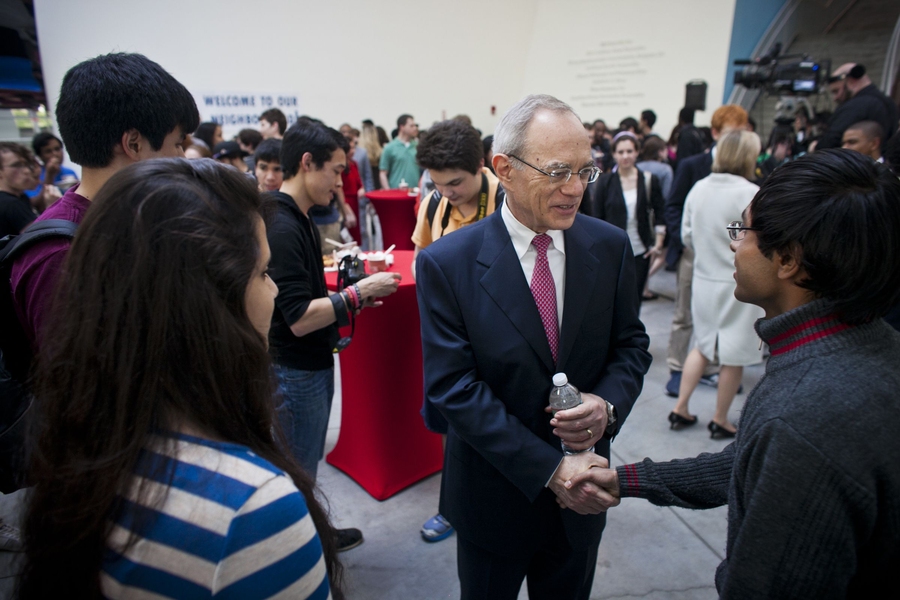 Reif talks to a student at a welcome event in the evening.