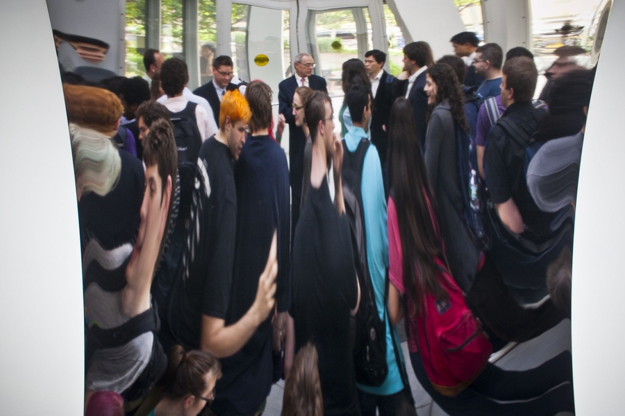 Reif and students at the evening event are seen in the reflection of the Anish Kapoor sculpture in the Stata Center.