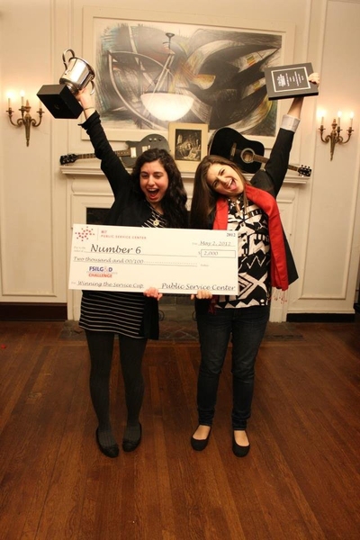 Deema Totah '10 and Nina Jreige '11, Community Service Chairs of The Number Six Club pause for some celebratory photos after receiving the cup and prize in the Award Reception on May 2.