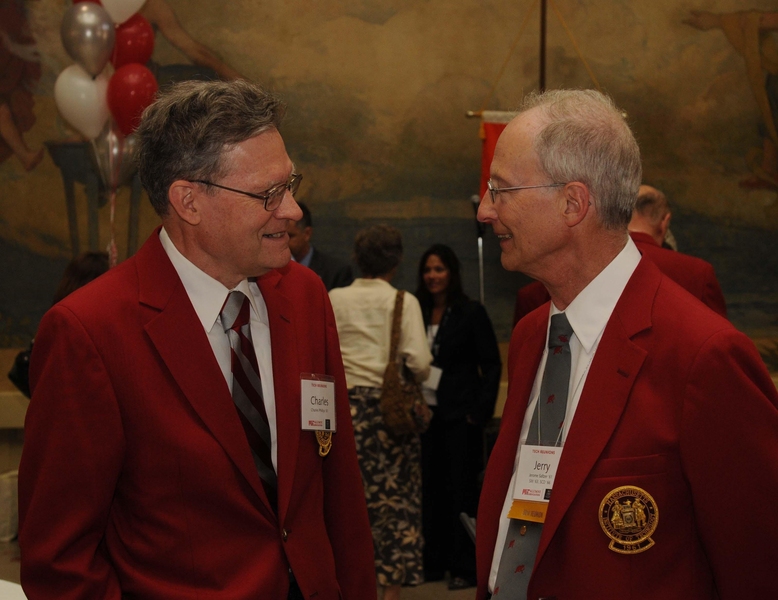 Charles Phillips '61 and Jerry Saltzer '61, SM '63, ScD '66 — fully decked out in red jackets and insignia — enjoy a 50th reunion gathering last year.