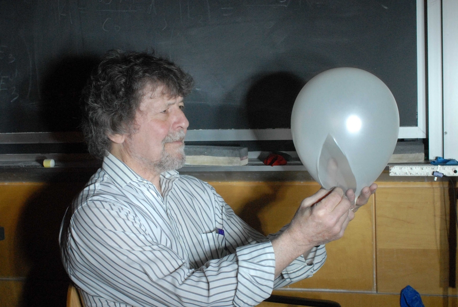 Tony Costello pops a balloon.