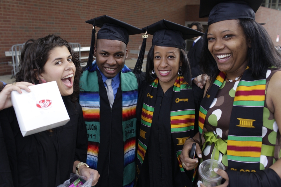 Graduating students gather for a posed photo outside of Rockwell Cage, where they lined up for the procession into the ceremony in Killian Court. 