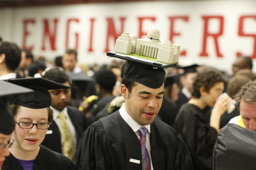 A student proudly wears a scale replica of Killian Court, the site of the Commencement ceremony, on his mortarboard.