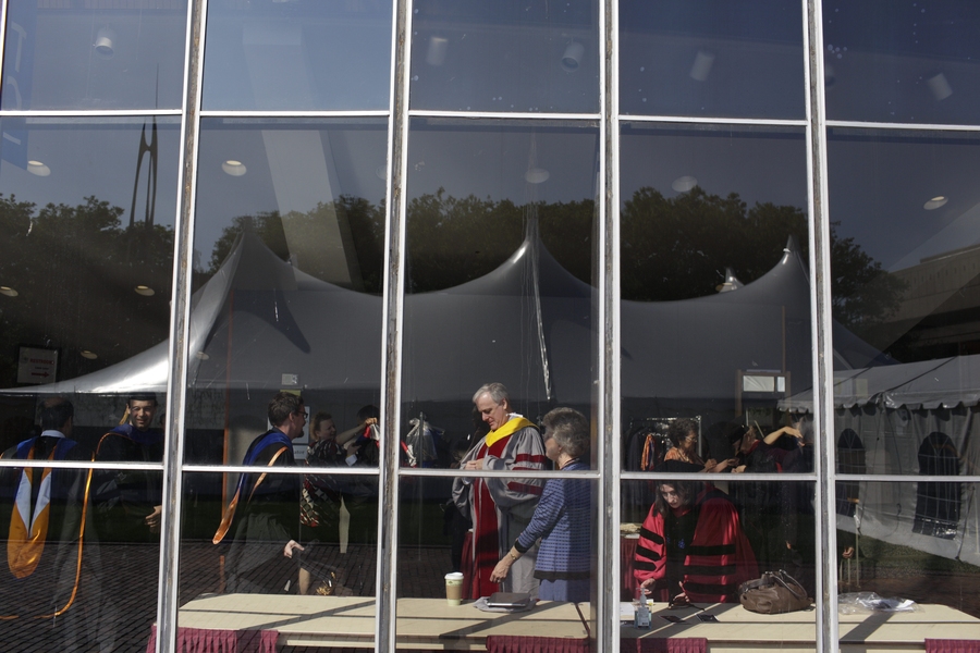 Faculty members get ready before the ceremony in Kresge Auditorium.