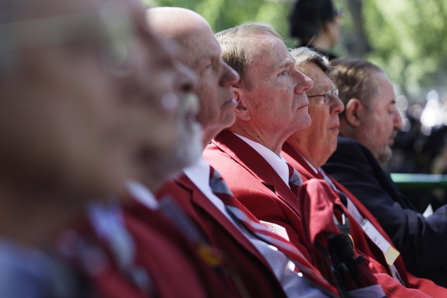 The &#39;Red Coats&#39; listen intently from their seats in Killian Court during the ceremony.