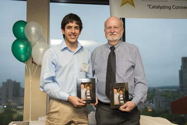 Harry Sanabria, left, and Professor John Belcher, right, are honored with the “Ionic Bond” award.