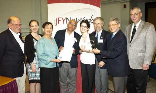 From left to right: Chuck Shubert, Alison Brauneis, Representative Alice Peisch, Vijay Kumar, Lourdes Alemán, Graham Walker, Gary Kaplan, David Stanley.