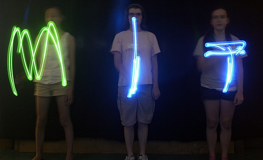 Ninth-grade girls in the Edgerton Center's You GO Girl science and engineering program experimenting with strobe-light photography.