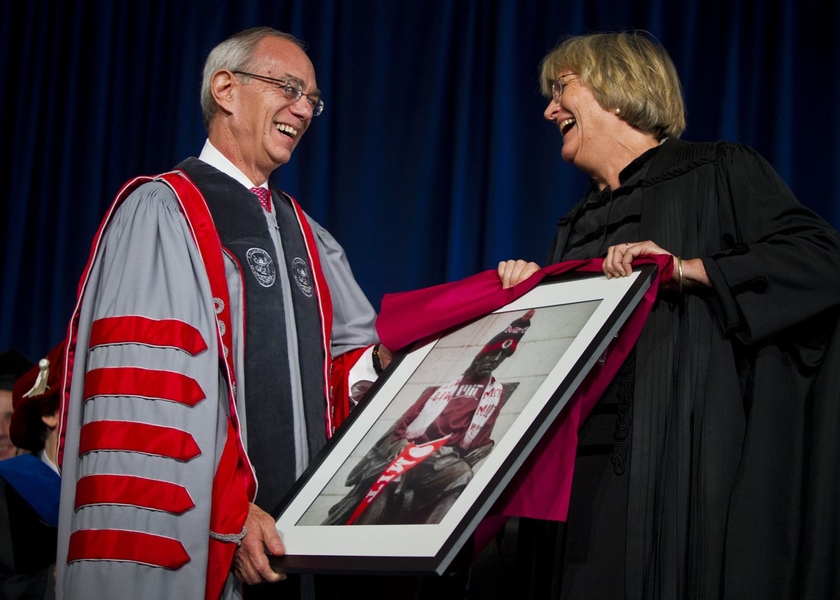 Reif receives a framed picture of the John Harvard statue adorned with MIT regalia from Harvard President Drew Gilpin Faust, who spoke at the ceremony on behalf of the academic community and good-heartedly touched on MIT's history of 'hacks.'