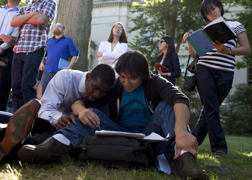Community members sat on the grass outside of the tent on Killian to listen to the proceedings.