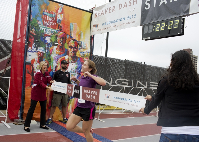 The president&#39;s wife, Christine, was on hand to hold the tape as the lead female runner, Claire Derosa, finished the race.