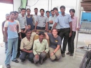 Tish Scolnik '10, executive director of Global Research Innovation Technology and a current Phase III Scale-Ups fellow, with the staff at Pinnacle, the manufacturer in India of the Leveraged Freedom Chair, an innovative off-road mobility device.