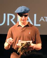 Bradley Genser as Kreon issuing royal decrees, coffeehouse poet style.