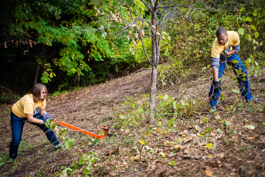 Miller and Stuopis work together to prune and pull weeds at the Arboretum.