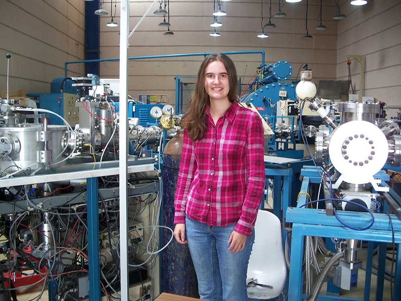 Taylor is pictured inside the lab where she worked in the Instituto de Física at the Universidad Nacional Autónoma de México (UNAM). The equipment behind Taylor is a synchrotron used for Particle Inducing X-Ray Emission (PIXE), a non-destructive technique used to determine chemical composition.