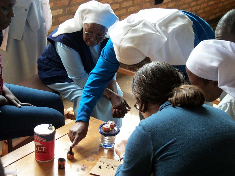 Nurses testing water for bacterial content (fecal contamination) using D-Lab's low-cost water testing kit in rural Uganda.