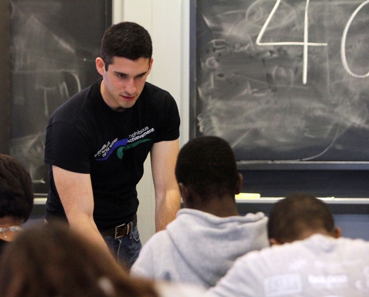 Angrist gives a pep talk to Ian Williams during his critical reading Show Your Skillz — Amphibious Achievement's version of a diagnostic.