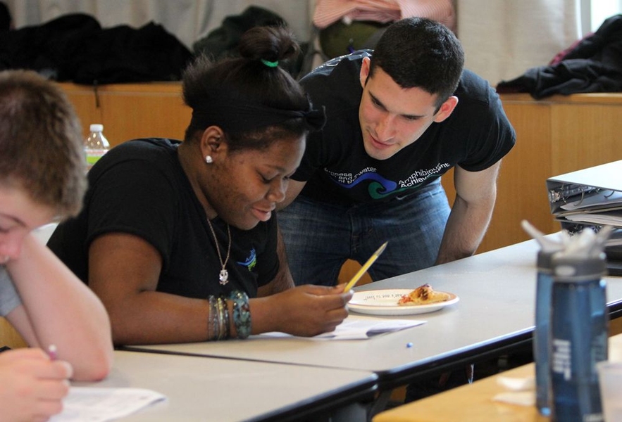 Angrist provides positive feedback to Dalesha St. Louis, one of the first Achievers to join Amphibious Achievement two years ago. Positive feedback is one of the key components of Amphibious Achievement, which many students might not experience in their day-to-day lives and is one of the main reasons they come to MIT every Sunday.