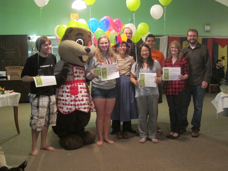 Winners of the Apple Breakfast category earned bragging rights and celebrated with Tim the Beaver and their House Team. From left to right: Sam Trabucco, Rachel Nations, Tim the Beaver, Housemasters Anne and William McCants, Cynthia Jing, Nathan Miller, and Kayla Berry and Kalen Berry (GRTs).