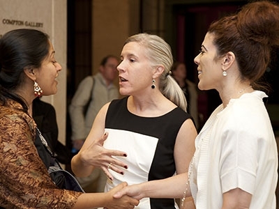 Jennifer Recklet Tassi (right), program manager for MIT Spouses & Partners, introduces group member Sukanya Swetharanyan (left) to Dean for Graduate Education Christine Ortiz.