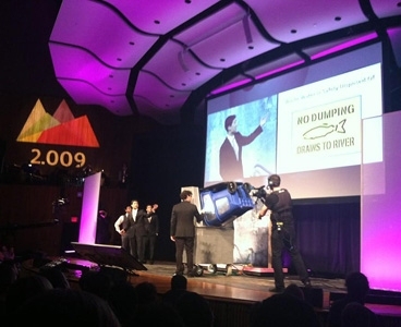 Team members demonstrate HERC, a receptacle cleaner designed for MIT facilities.