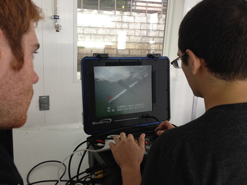 Tommy Moriarty and Adrian Tanner monitor the glider on video camera as it travels down 45 feet into the ocean. Their goal is to reach a mile.