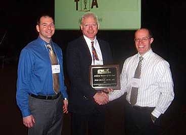 Tom Cronan (center) poses with MIT Athletic Trainer Scot Spak and Thomas Dodge, president of the Athletic Trainers of Massachusetts.