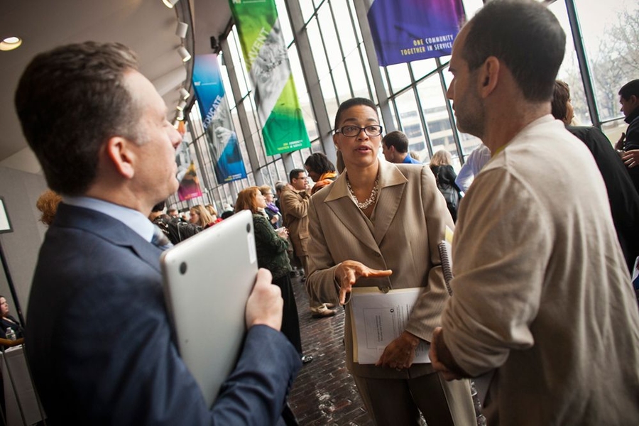 Denise Lewin Loyd of the Sloan School, center, answered questions about her research during a break in MIT's Diversity Summit.