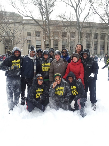 Chocolate City members pose with President L. Rafael Reif and his wife, Christine, during the snowball fight on Killian Court.