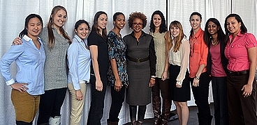 Paula Madison (center) poses with the MIT women's basketball team.