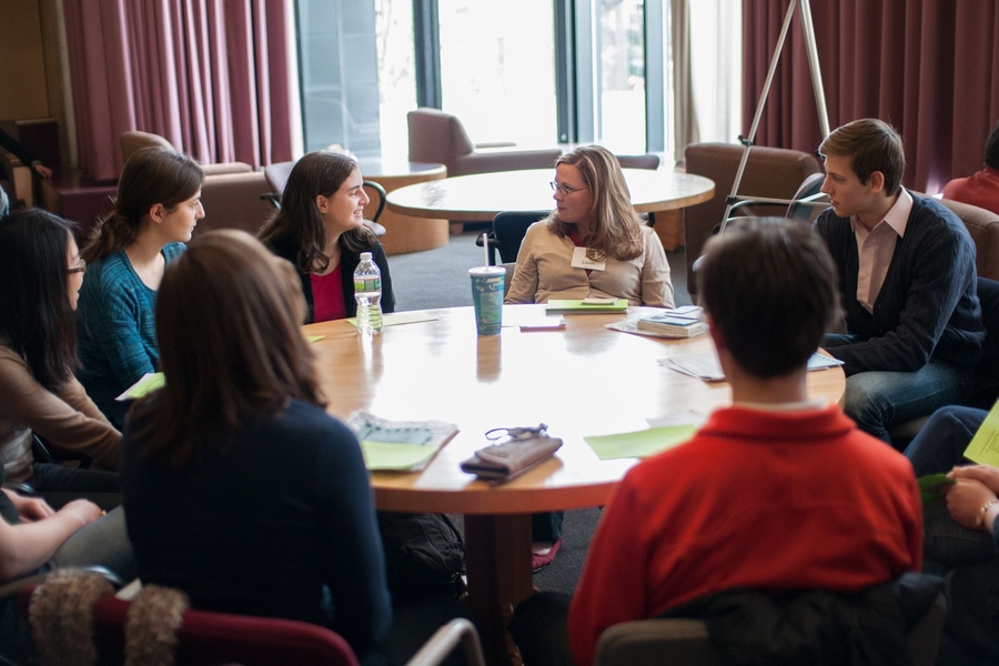 Leah Flynn (center), assistant dean and director for student leadership and engagement, spoke to students about how to make a charming first impression