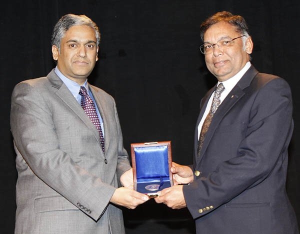 Anantha Chandrakasan, left, receives the 2013 IEEE Donald O. Pederson Award from IEEE Solid-State Circuits Society president Rakesh Kumar at the 60th Anniversary Plenary Session of the IEEE International Solid State Circuits Conference awards presentation on Feb. 18.