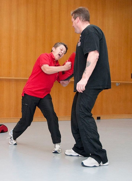 MIT Police Sergeant Cheryl Vossmer and Detective Willard Boulter demonstrate various strikes and stances during the RAD course.