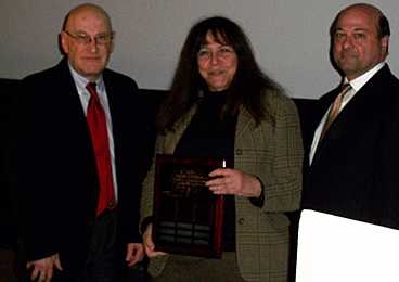 Professor Joseph Sussman (left) presented the Martore Award to Professor Nancy Leveson. Joseph Martore is at right.