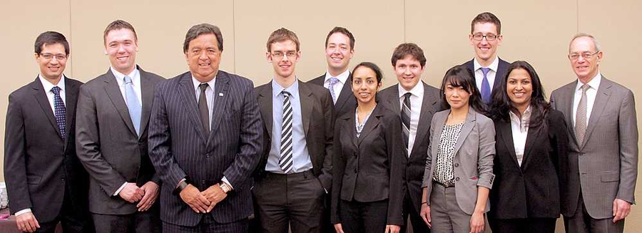 Energy Conference keynote speaker Bill Richardson, third from left, and MIT President L. Rafael Reif, right, pose with student organizers of the conference, including managing director Daniel Connell, second from left.