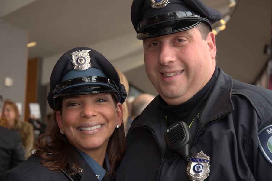 Serving the Client award recipient Officer Jennifer Ortiz (left) with Officer Robert Aurilio (right).