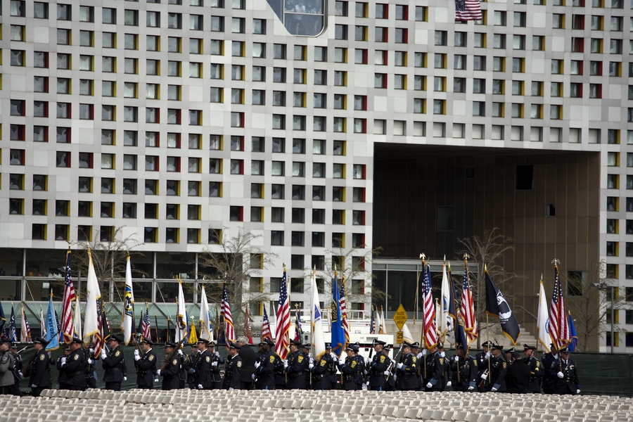 Honor guards from several police departments carried flags onto Briggs Field.