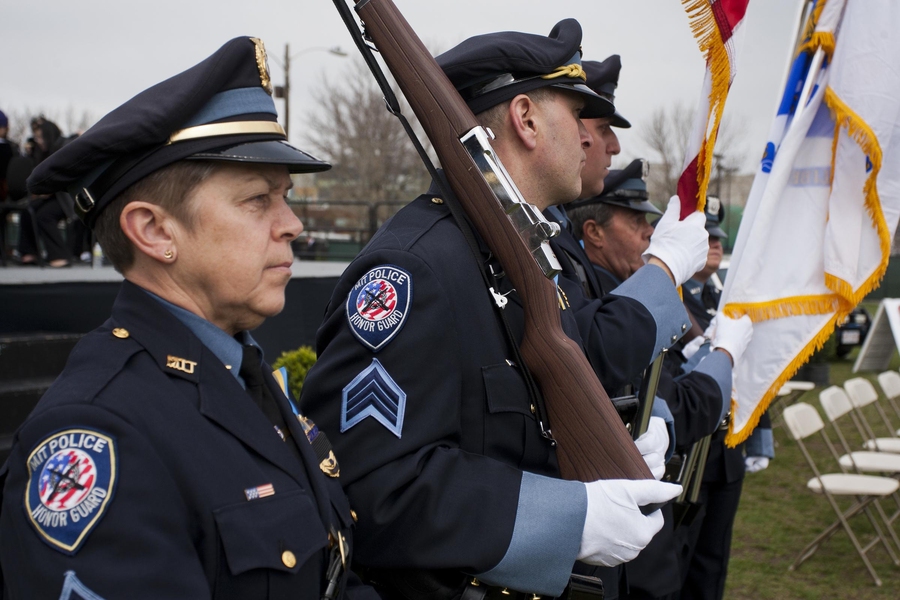 MIT Police Sergeant Cheryl Vossmer, left, stood at attention with other members of the MIT Police Color Guard.
