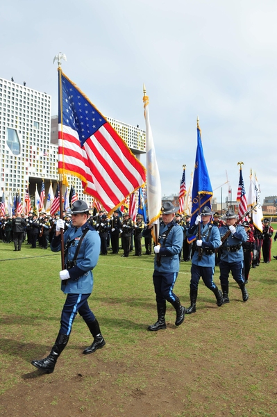 Members of the Massachusetts State Police march into the memorial ceremony.