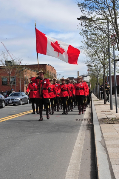 Members of the Royal Canadian Mounted Police march into the memorial ceremony.