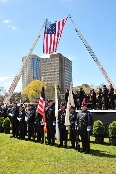 A large American flag was hung from two ladders from the Cambridge Fire Department.
