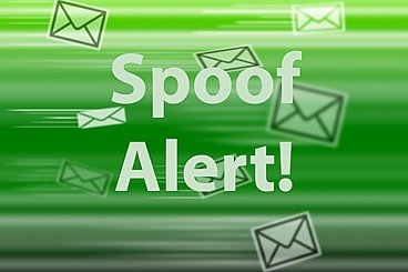 "Spoof alert!" is in white text with envelope icons in green background.